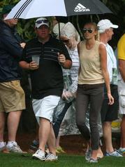 paulina gretzky is out in the rain at the masters supporting dustin johnson